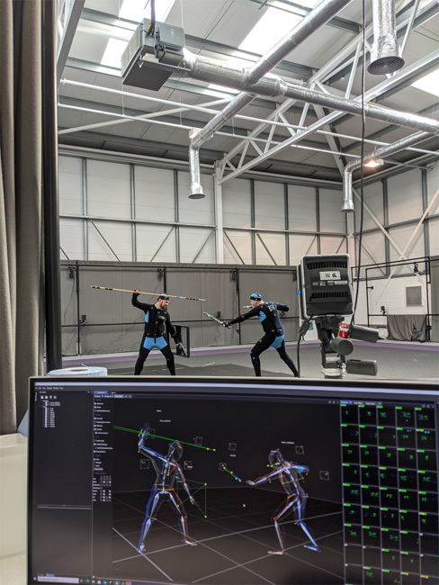 2 people in fight performance motion capture suits.